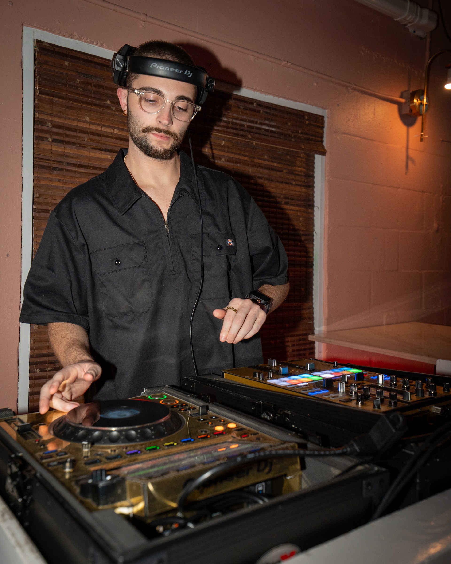 A DJ working at the decks inside The Standard Delray Beach