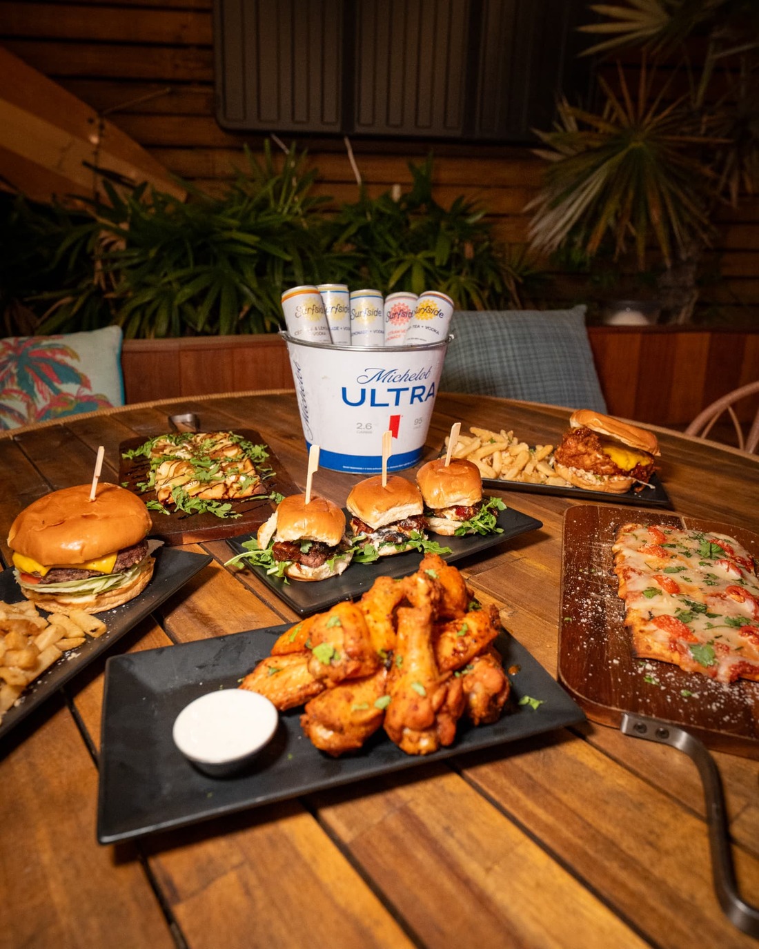 Shared plates and drinks on a table at The Standard